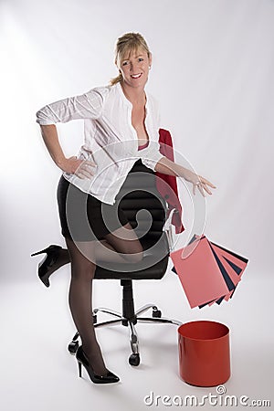 Secretary dropping files into a bin Stock Photo