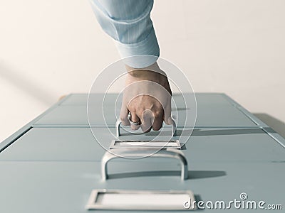 Secretary searching files in the filing cabinet Stock Photo