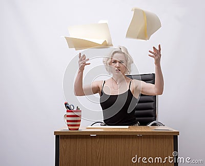 Secretary throwing papers into the air Stock Photo