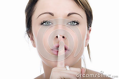 Secretive Young Woman with Finger on Lips Stock Photo