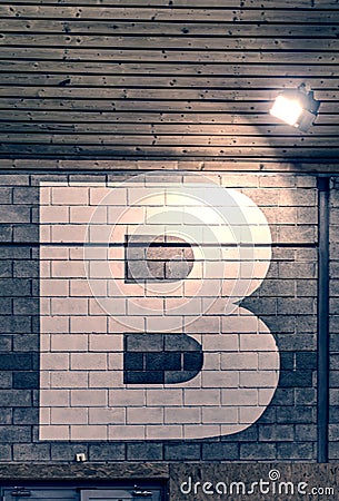 Section B. Letter B sign painted in sport hall for orientation Stock Photo