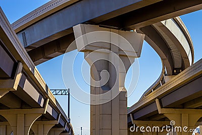 Section of elevated highway with several levels against a bright blue sky in Houston, Texas Stock Photo