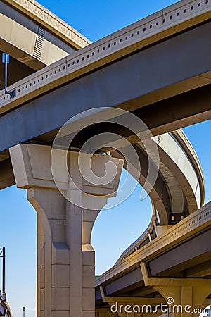 Section of elevated highway with several levels against a bright blue sky in Houston, Texas Stock Photo