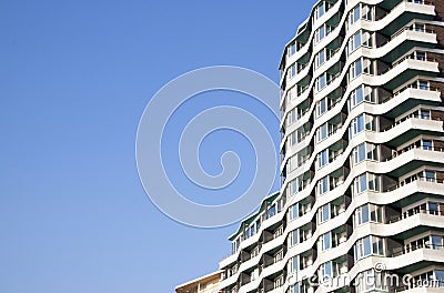 Section of High Rise Apartments Against Blue Sky Stock Photo