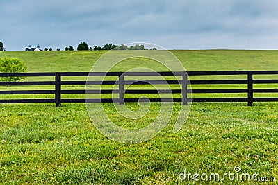 Section of Horse Fence and Pasture Stock Photo