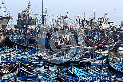 A section of the huge fishing boat fleet at the port of Essaouira on the west coast of Morocco. Stock Photo