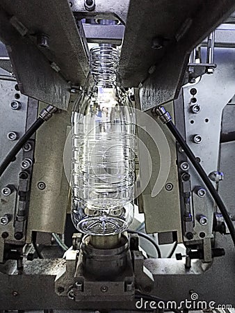 Section of a line of industrial equipment, manufacture of containers for milk or liquids. Stock Photo