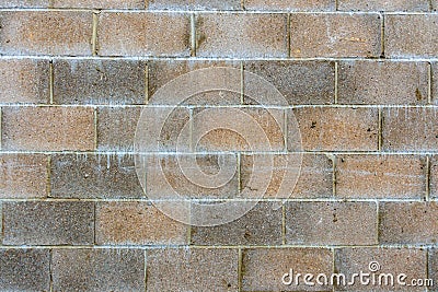 Section of a red and grey breeze block wall Stock Photo