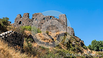 Armenia, Amberd, September 2022. The ruins of the walls of an ancient fortress on the mountain. Stock Photo