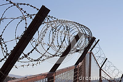 Security with a barbed wire fence. Protection concept design. Stock Photo