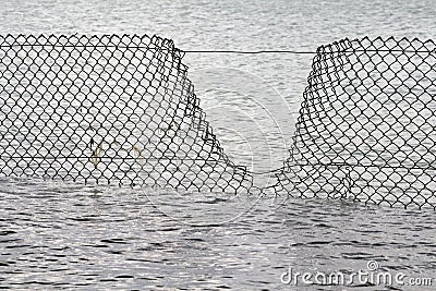 Security Breach - Water Fence Stock Photo