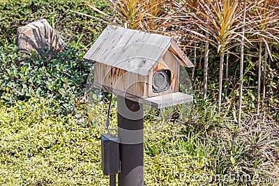 Security camera CCTV in small country barn model near entrance s Stock Photo