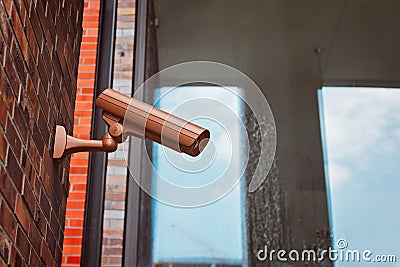 Security camera mounted on the building wall Stock Photo