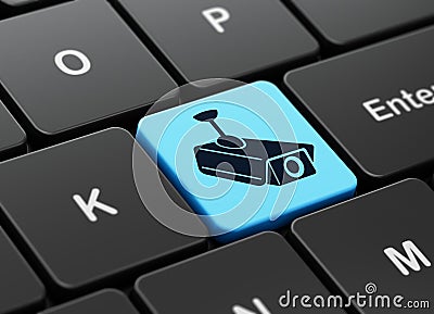 Security concept: Cctv Camera on computer keyboard Stock Photo