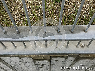 Security fence with iron bars seen from above. border fence or prison concept Stock Photo