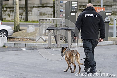 Security guard with a dog Editorial Stock Photo