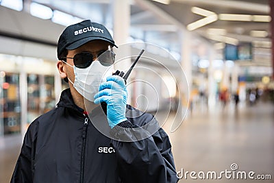 Security Guard Standing In Face Mask Stock Photo