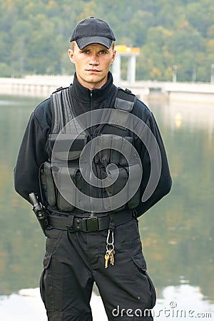 Security guard in uniform and armed Stock Photo