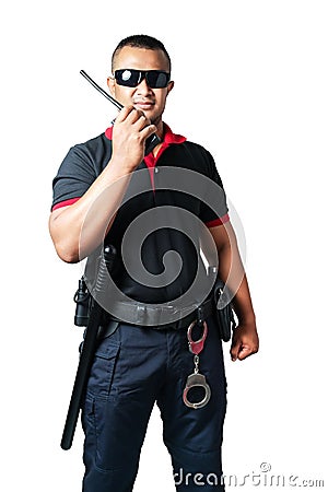 Security guards wear dark glasses. stand holding a radio There are rubber batons and handcuffs on the tactical belt. on isolated Stock Photo