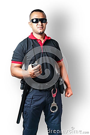 Security guards wear dark glasses. stand holding a radio There are rubber batons and handcuffs on the tactical belt. on isolated Stock Photo