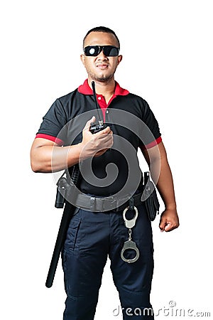 Security guards wear dark glasses. stand holding a radio There are rubber batons and handcuffs on the tactical belt. on isolated Stock Photo