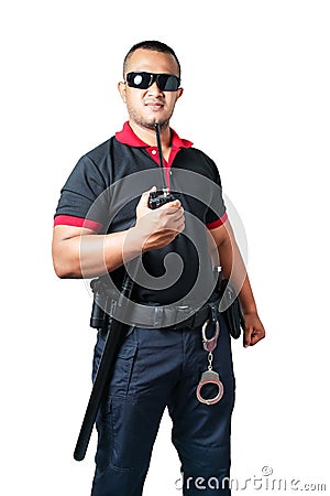 Security guards wear dark glasses. stand holding a radio There are rubber batons and handcuffs on the tactical belt. on isolated Stock Photo