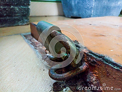 Padlock for goods stored in hidden house rooms Stock Photo