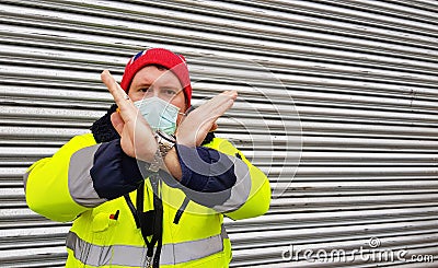 Security man is stopping someone to enter in the closed shop Stock Photo