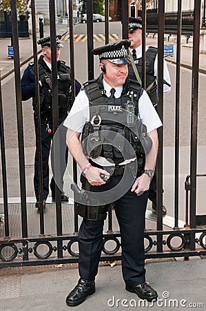 Security officers in front of the Downing Street 1 Editorial Stock Photo