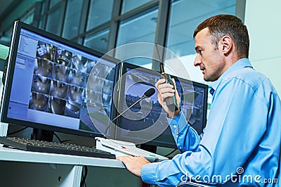 Security worker during monitoring. Video surveillance system. Stock Photo