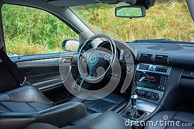 Sedan sport equipment car inside view, leather interior, chromed elements, front and back seats, luxury design Editorial Stock Photo