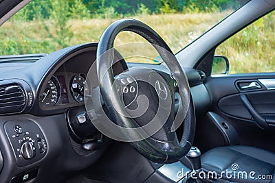 Sedan sport equipment car inside view, leather interior, chromed elements, front and back seats, luxury design Editorial Stock Photo