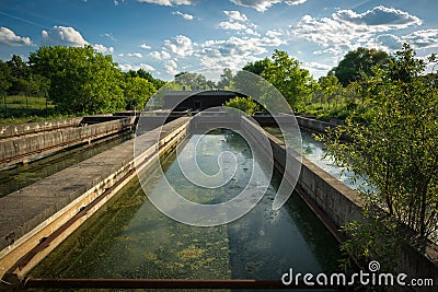 Sedimentation Tanks at Abandoned Sewage Treatment Plant Stock Photo