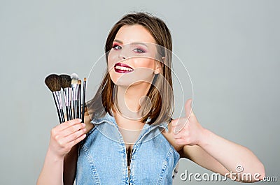 Seducing you. sexy woman with professional make up brush. beauty hairdresser salon. Lipstick and eyeshadow. sexuality Stock Photo