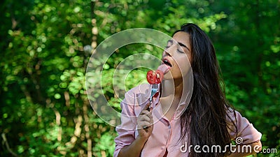 Seductive appetite. Her appetite is sexy. Woman full of desire hungry eating tomato. Girl holds fork with juicy ripe Stock Photo