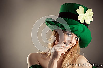 Seductive blond girl in image leprechaun Stock Photo