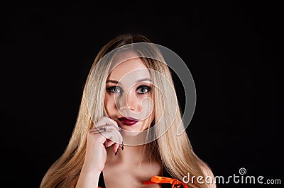 Seductive blond woman isolated on dark background Stock Photo