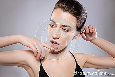 Seductive woman working on a new set of poses Stock Photo