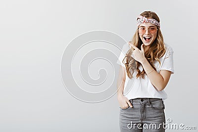 See that girl who got drunk last night. Portrait of excited charming caucasian woman with blond hair, wearing headband Stock Photo