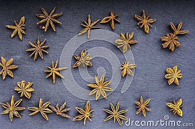 Seeds scattered star anise top view on slate Stock Photo