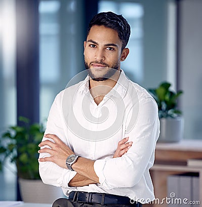 Seeing dreams come to fruition. a young businessman at work. Stock Photo