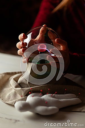 Seer with magic ball performs ritual. Psychic vision, fortune teller Stock Photo