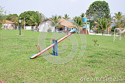 Seesaw, child`s toy in a tourist spot in Brazil, South America in panoramic view Stock Photo