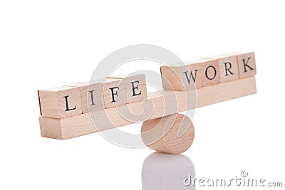 Seesaw representing imbalance between life and work Stock Photo