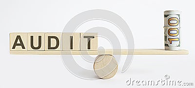 Seesaw Showing Balance Between money And word AUDIT Stock Photo