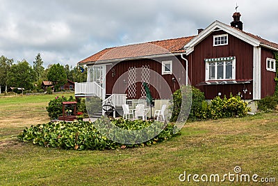 Segersta, Halsingland - Sweden - View over traditionale Swedish holiday homes in the fields Editorial Stock Photo