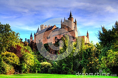 Segovia, Spain. The famous Alcazar of Segovia, rising out on a rocky crag, built in 1120. Stock Photo