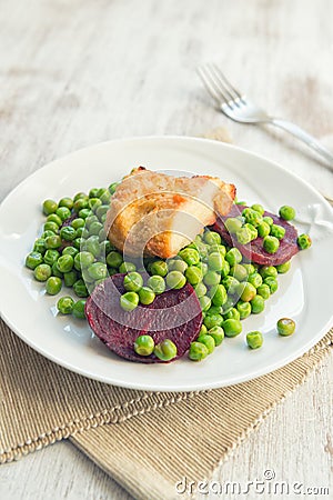 Seitan with peas and beetroots Stock Photo