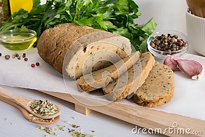 Seitan or vegan meat sliced with spices. Stock Photo