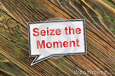 Seize the moment. Text inscription in the banner plate. Stock Photo